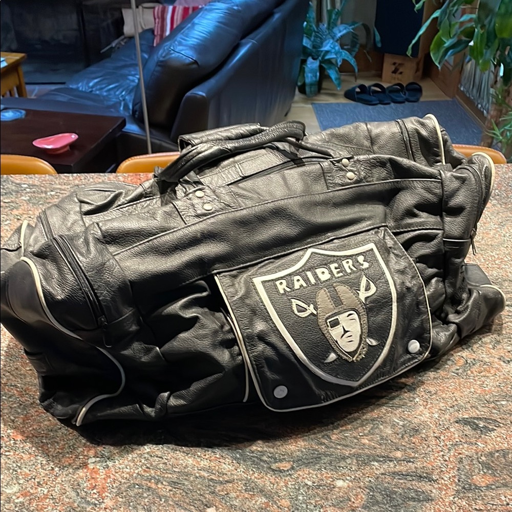 NFL Raiders black 24” leather duffle bag